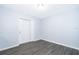 A bright room with gray wood laminate flooring at 5601 Andora St, Orlando, FL 32807