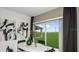 Cozy dining area with view of a large outdoor space through sliding glass doors at 5657 Loggia Ln, Kissimmee, FL 34758