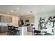Spacious kitchen featuring modern appliances, an island with seating, and lots of cabinet space at 5657 Loggia Ln, Kissimmee, FL 34758