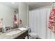 Updated bathroom featuring a granite countertop and decorative accents at 6822 Habitat Dr, Harmony, FL 34773