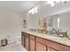 Bathroom featuring double sinks with granite countertops at 6822 Habitat Dr, Harmony, FL 34773