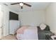 Bedroom with TV and ceiling fan at 6822 Habitat Dr, Harmony, FL 34773