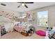 bedroom with bunkbeds and a ceiling fan at 6822 Habitat Dr, Harmony, FL 34773