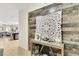 Stylish entryway featuring a decorative wood accent wall and elegant console table, creating a warm ambiance at 6822 Habitat Dr, Harmony, FL 34773