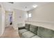 Upstairs hallway with carpet and a comfortable couch at 6822 Habitat Dr, Harmony, FL 34773