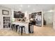 Bright kitchen with granite countertops, stainless steel appliances, and dark cabinets at 6822 Habitat Dr, Harmony, FL 34773