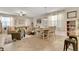 Bright, open-concept living space with comfortable seating and dining area, perfect for entertaining at 6822 Habitat Dr, Harmony, FL 34773