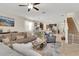 Open concept living area with views of the dining and kitchen at 6822 Habitat Dr, Harmony, FL 34773
