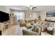 Comfortable living room features neutral decor and a ceiling fan at 6822 Habitat Dr, Harmony, FL 34773