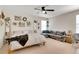 Spacious primary bedroom includes a ceiling fan and decorative wall art at 6822 Habitat Dr, Harmony, FL 34773