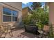 Cozy brick patio area, ideal for outdoor dining and relaxation, surrounded by lush greenery at 6822 Habitat Dr, Harmony, FL 34773
