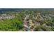 Aerial view of the home nestled in a tranquil, tree-filled neighborhood with well-maintained streets at 694 Tuscora Dr, Winter Springs, FL 32708
