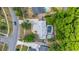 Bird's eye view of a residence highlighting a pool, tidy landscaping, and a paved driveway in a residential neighborhood at 694 Tuscora Dr, Winter Springs, FL 32708