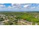 An aerial view displaying a home situated among an abundance of greenery in a quiet suburban neighborhood at 694 Tuscora Dr, Winter Springs, FL 32708