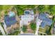 A serene aerial perspective of a home boasting a private pool, bordered by mature trees and well-kept lawns at 694 Tuscora Dr, Winter Springs, FL 32708