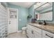 Bathroom with vanity, granite countertops, modern hardware, and a walk-in shower at 694 Tuscora Dr, Winter Springs, FL 32708