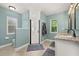 Charming bathroom with dual sinks, granite countertops, decorative mirrors, and a glass-enclosed shower at 694 Tuscora Dr, Winter Springs, FL 32708