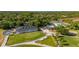 Aerial view of a golf course with lush green fairways, manicured lawns, and a clubhouse in a beautiful community at 694 Tuscora Dr, Winter Springs, FL 32708