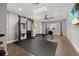 Spacious home gym featuring tile floors, modern equipment, and natural light at 694 Tuscora Dr, Winter Springs, FL 32708