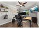 Functional home office with a large desk, ergonomic chair, and ample storage space for productivity at 694 Tuscora Dr, Winter Springs, FL 32708