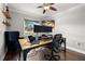 Bright home office offering a ceiling fan, chair, and window view at 694 Tuscora Dr, Winter Springs, FL 32708