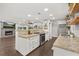 Kitchen with stainless steel appliances, granite countertops, and open shelving with decorative accents at 694 Tuscora Dr, Winter Springs, FL 32708
