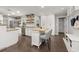 Bright kitchen features a breakfast bar, floating shelves, stainless steel appliances and lots of cabinets at 694 Tuscora Dr, Winter Springs, FL 32708