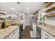Kitchen featuring white cabinets, stainless steel appliances, and granite countertops at 694 Tuscora Dr, Winter Springs, FL 32708