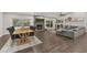 Open-concept living space showing dining area, brick fireplace, and a comfortable living room setup at 694 Tuscora Dr, Winter Springs, FL 32708