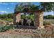 Charming entrance to Mount Trowood featuring stone pillars, wood accents, and bear statues at 694 Tuscora Dr, Winter Springs, FL 32708