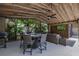 The screened patio includes a ceiling fan, TV, dining and seating area, perfect for entertaining at 694 Tuscora Dr, Winter Springs, FL 32708