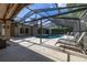 The screened pool area has lounge chairs and a patio, creating an inviting space for relaxation and recreation at 694 Tuscora Dr, Winter Springs, FL 32708