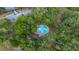Aerial view of a water fountain in a park surrounded by green trees and walking trails in a beautiful community at 694 Tuscora Dr, Winter Springs, FL 32708