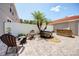This backyard features a paver patio, outdoor seating, a built in grill, and palm trees at 7348 Yoder St, Windermere, FL 34786