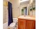 This bathroom has a shower and bathtub, with a vanity and a toilet at 7348 Yoder St, Windermere, FL 34786