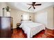 A bright bedroom featuring a ceiling fan, closet, and a modern style bedframe at 7348 Yoder St, Windermere, FL 34786