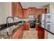 Well-equipped kitchen featuring stainless steel appliances, granite countertops, and ample cabinet space for storage at 7348 Yoder St, Windermere, FL 34786