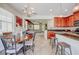 Inviting dining area flowing to the modern kitchen, offering a seamless transition for easy entertaining at 7348 Yoder St, Windermere, FL 34786