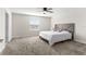 Comfortable bedroom features a ceiling fan, soft carpet, and neutral paint at 740 Simone Ct, Haines City, FL 33844