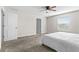 Bright bedroom with a ceiling fan, plush carpeting, and ample natural light at 740 Simone Ct, Haines City, FL 33844
