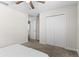 Bedroom featuring carpet, an open door to a bathroom, and a closet at 740 Simone Ct, Haines City, FL 33844