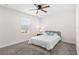 Bright bedroom with plush carpet, a ceiling fan and natural light from a window at 740 Simone Ct, Haines City, FL 33844