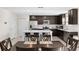 Modern kitchen featuring stainless steel appliances, center island with breakfast bar and dark wood cabinetry at 740 Simone Ct, Haines City, FL 33844