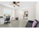 Versatile living area featuring neutral flooring, ceiling fan, with ample room for office and seating at 740 Simone Ct, Haines City, FL 33844