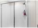 Tiled shower with a glass door and built-in shelving in bathroom at 740 Simone Ct, Haines City, FL 33844