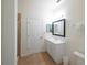 Bright bathroom features tiled floor, walk-in shower, and closet at 7505 Pellham Way, Kissimmee, FL 34747