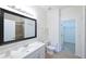 Bright bathroom features large mirror, tiled floor, and walk-in shower at 7505 Pellham Way, Kissimmee, FL 34747