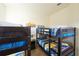 Bedroom with two sets of bunk beds, all with minion-themed bedding and decor at 7505 Pellham Way, Kissimmee, FL 34747