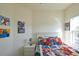 Bedroom features a bed with superhero-themed bedding and decorations at 7505 Pellham Way, Kissimmee, FL 34747