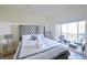 Bedroom features a luxurious bed with patio access at 7505 Pellham Way, Kissimmee, FL 34747